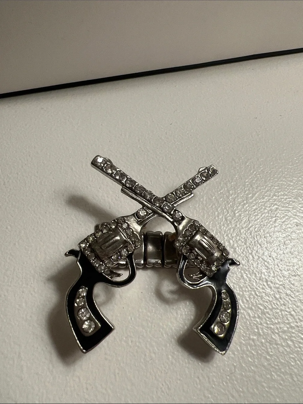 Silver-tone Crossed Revolver Stretch Ring - Black Accents